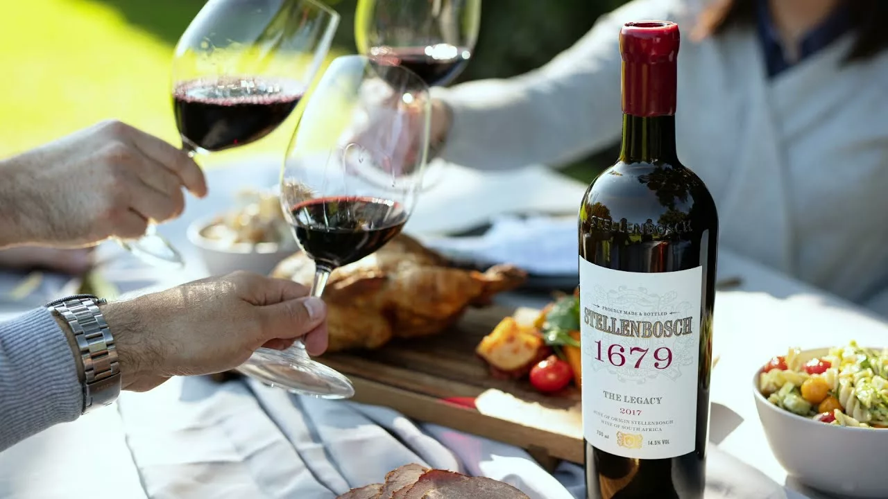 Cheers With Stellenbosch Wine At A Sunny Outdoor Gathering.