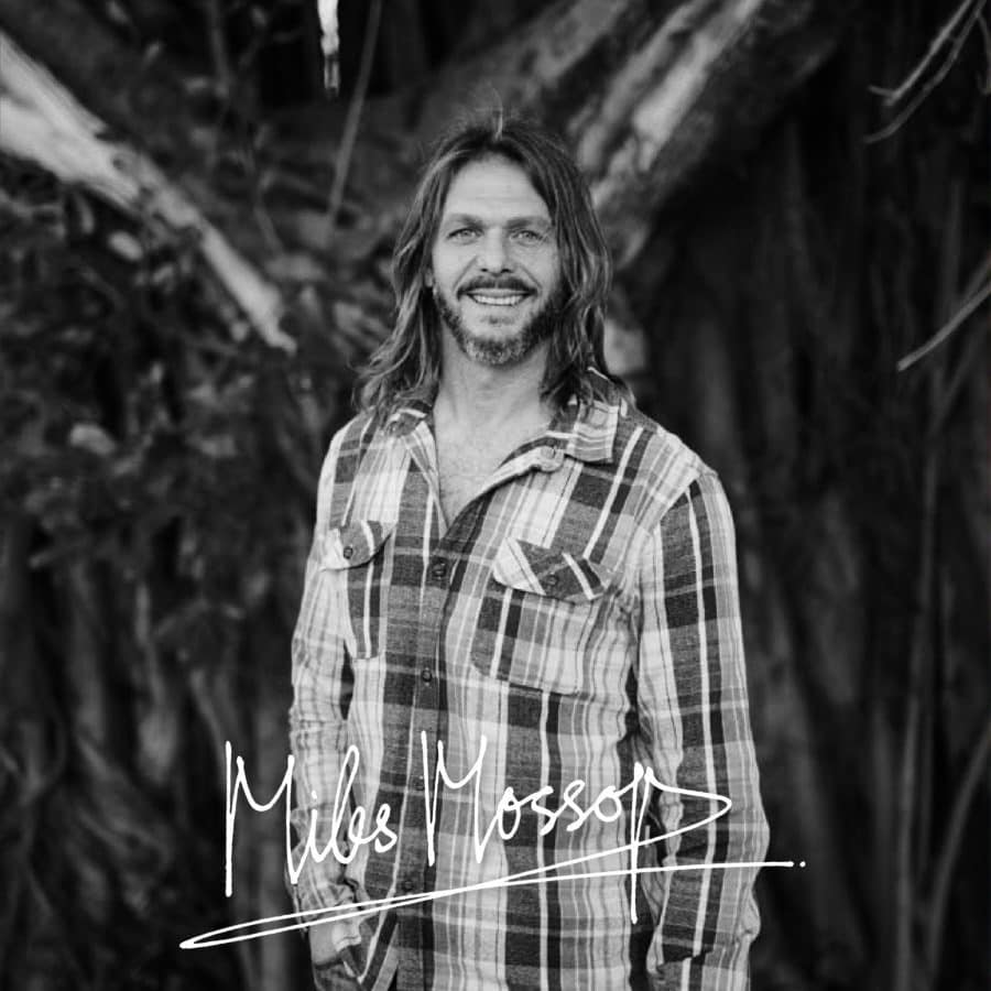 Smiling winemaker Miles Mossop in a plaid shirt, Stellenbosch.